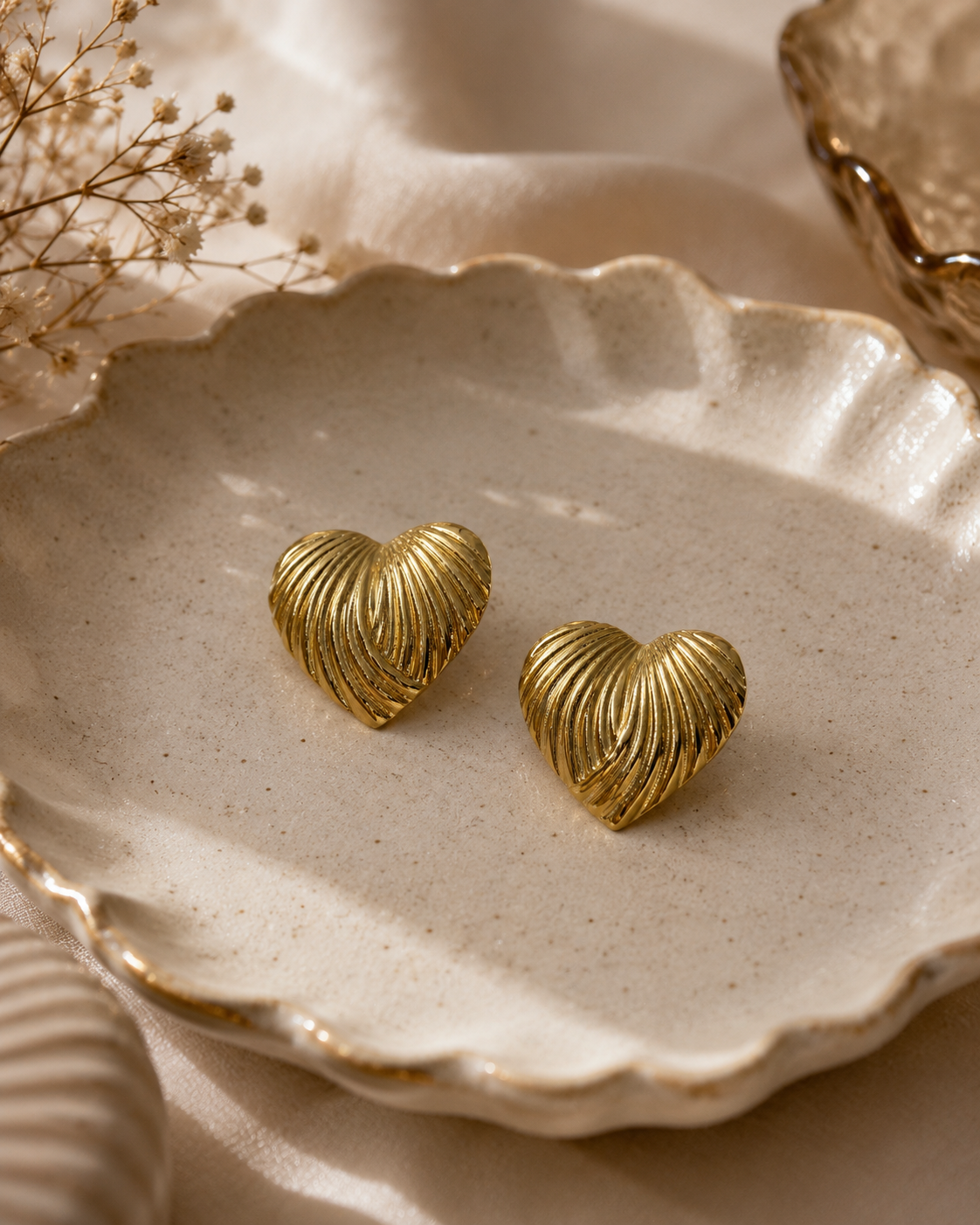 Golden striped hearts studs